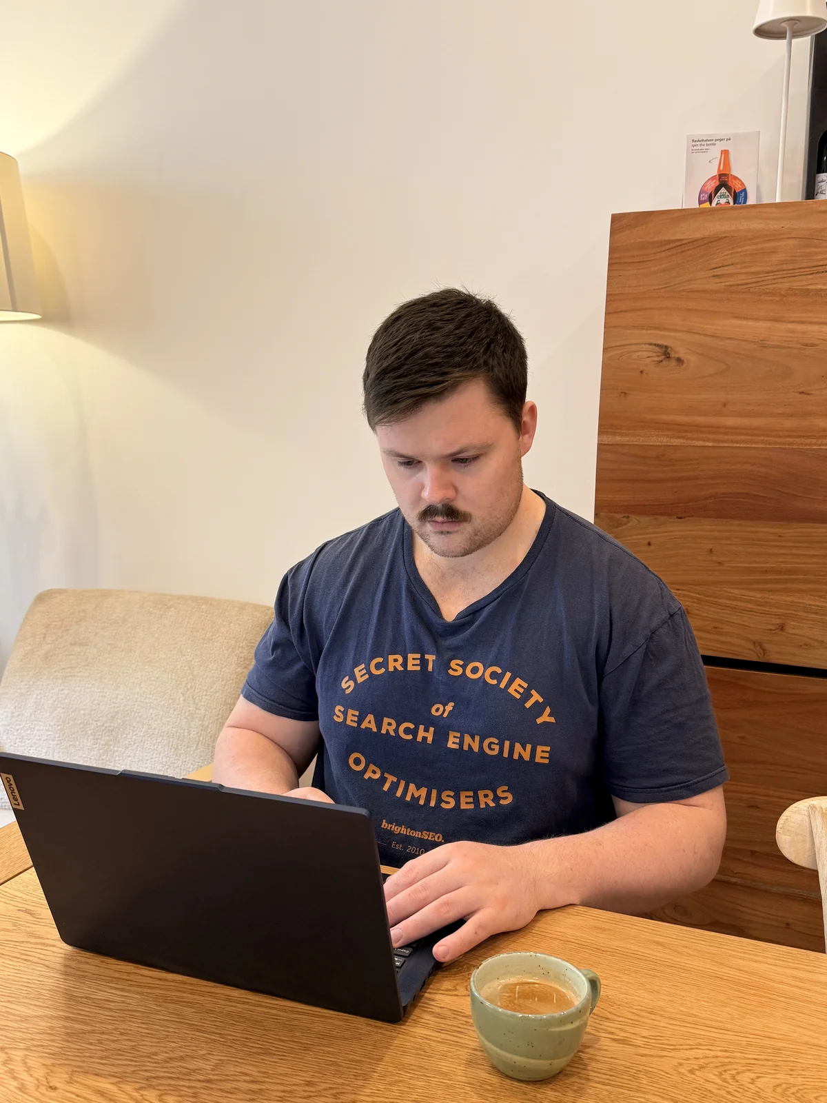 Charlie Johns working on a laptop, planning a digital marketing strategy for a small business in Ireland